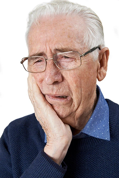 man experiencing tooth pain
