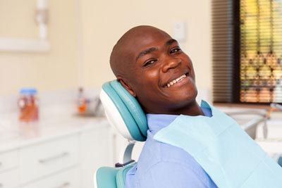 man smiling in the dental chair at Acre Wood Dental - Round Rock
