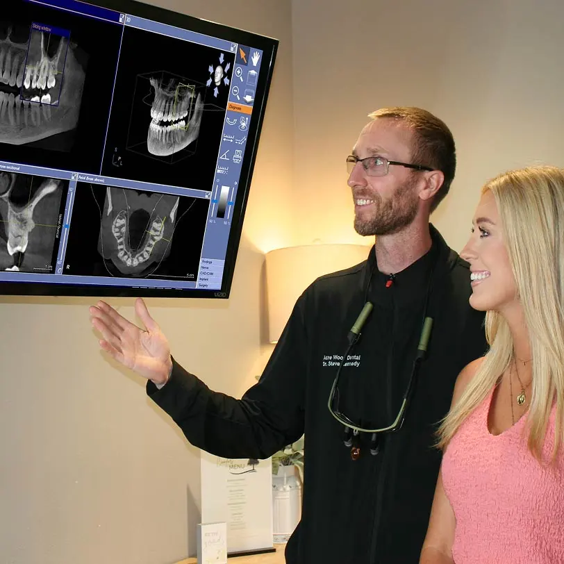 Temple, TX dentist showing patient her X-rays
