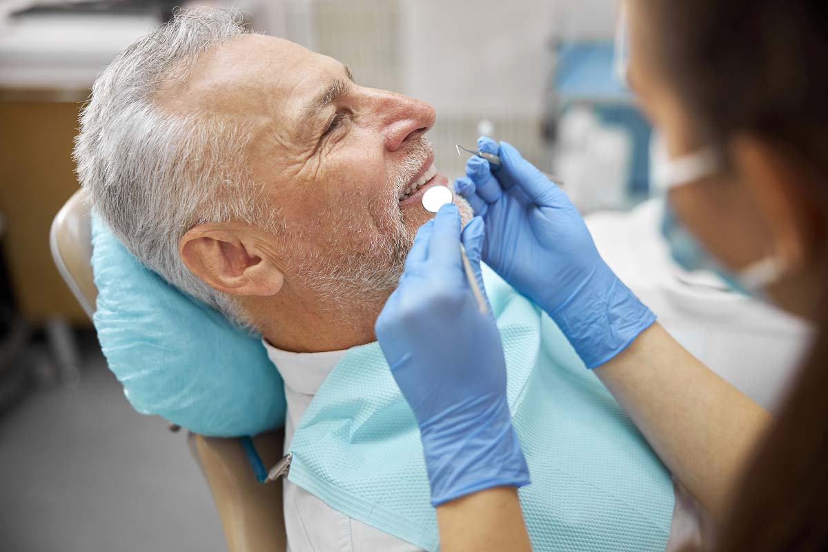 Dentist applying all-on-5 dental implants to a patient in Temple, TX