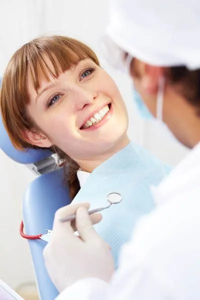 woman smiling during her visit to Acre Wood Dental in Waco, TX