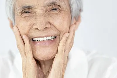 woman smiling after getting dental implants in Waco, TX