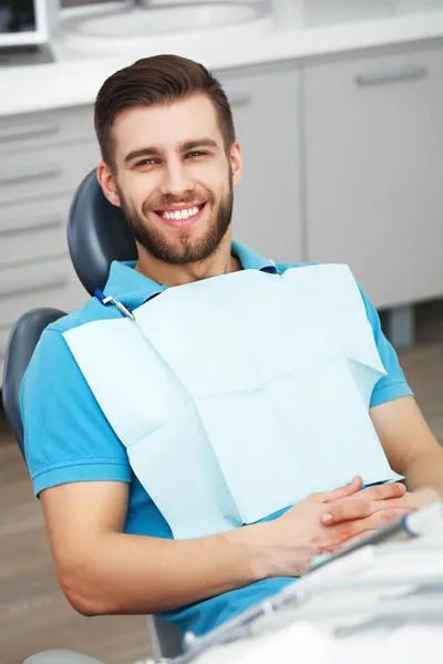 man smiling during his dental visit to Acre Wood Dental - Waco