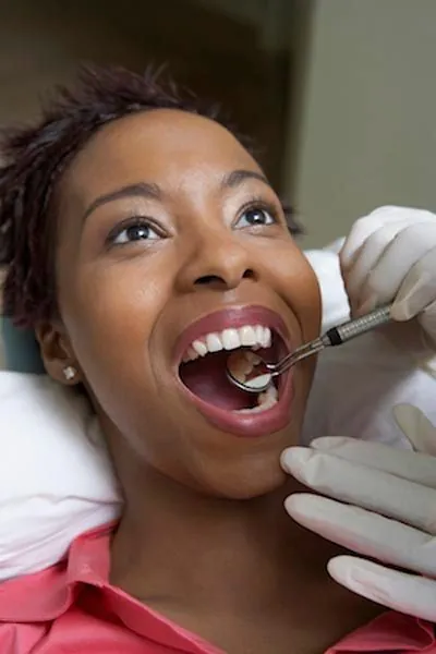 woman getting a dental checkup in Waco, TX