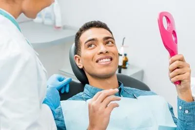man happy with his dental implants from Acre Wood Dental - Waco