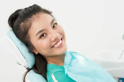 woman smiling during her dental visit at Acre Wood Dental - Waco