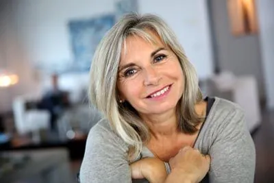woman with all-on-5 dental implants from Acre Wood Dental - Waco