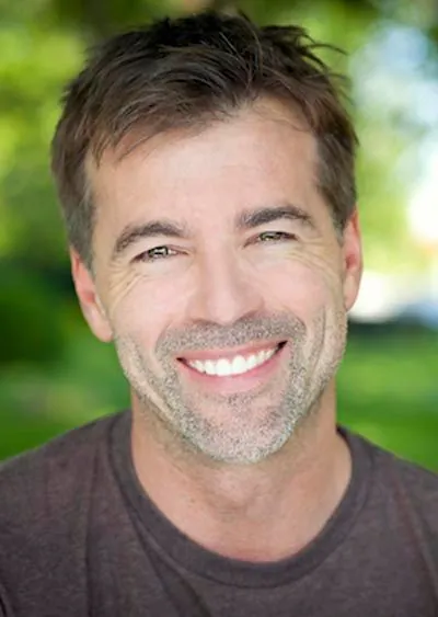 man showing off his smile after oral surgery at Acre Wood Dental - Waco